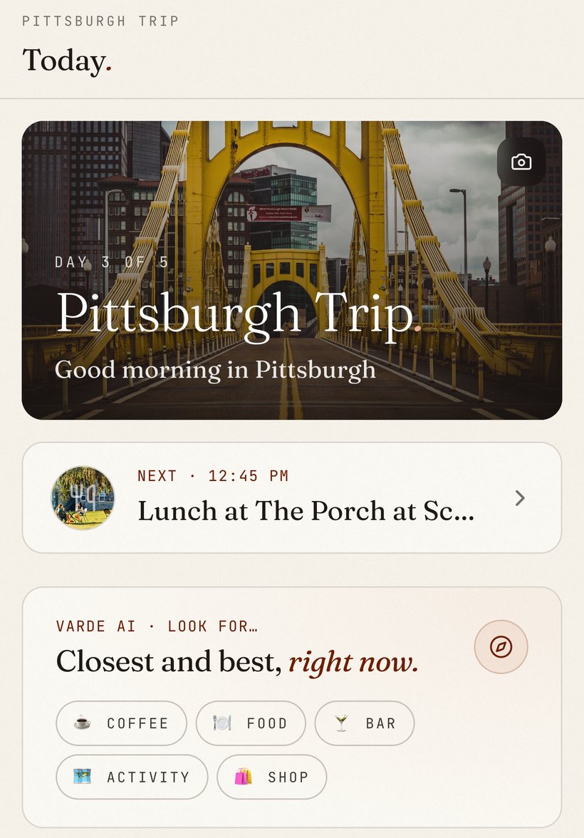 The Today screen in Varde: the day's hero photo, the next stop coming up, and Varde AI's nearby picks.
